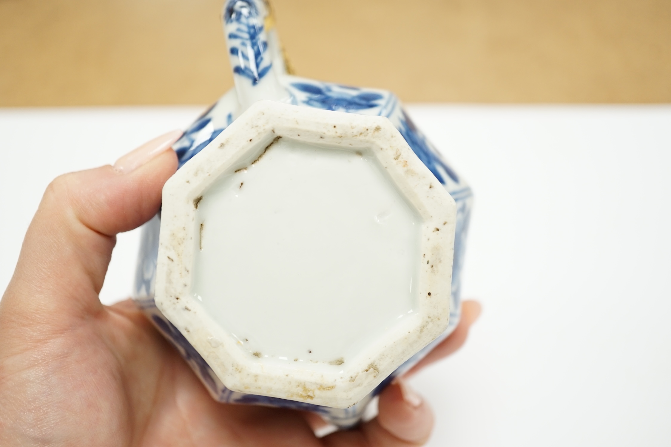 A Chinese blue and white octagonal teapot and cover with gilt metal mounts and a blue and white baluster vase, 16.5cm high, both 18th century